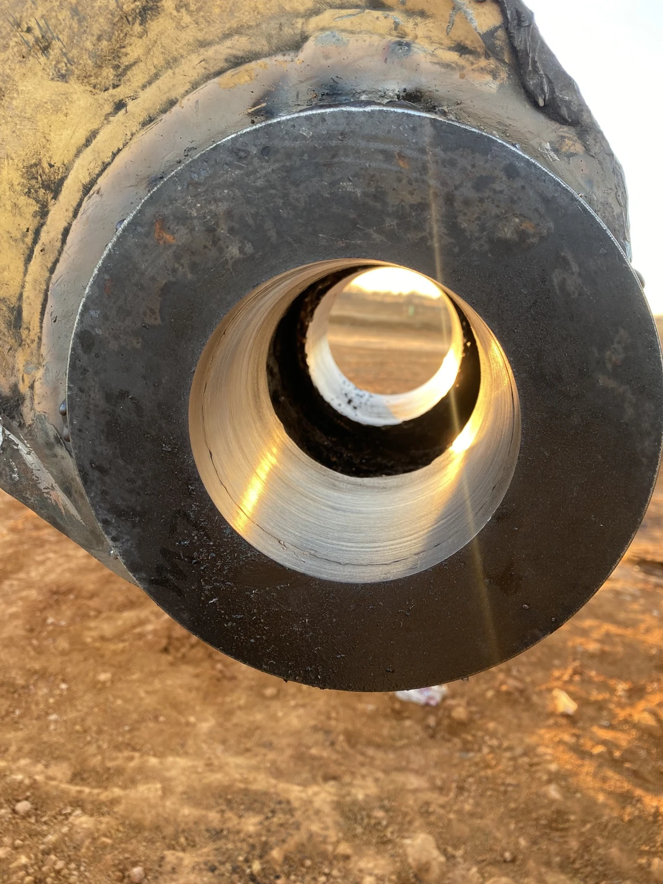Close-up of a machined bore in a heavy equipment pivot point